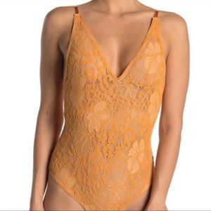 7. Free People Live It Up Lace V-Neck Bodysuit